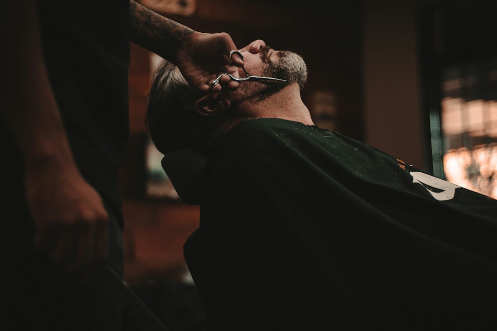 Professional barber grooming a client's hair